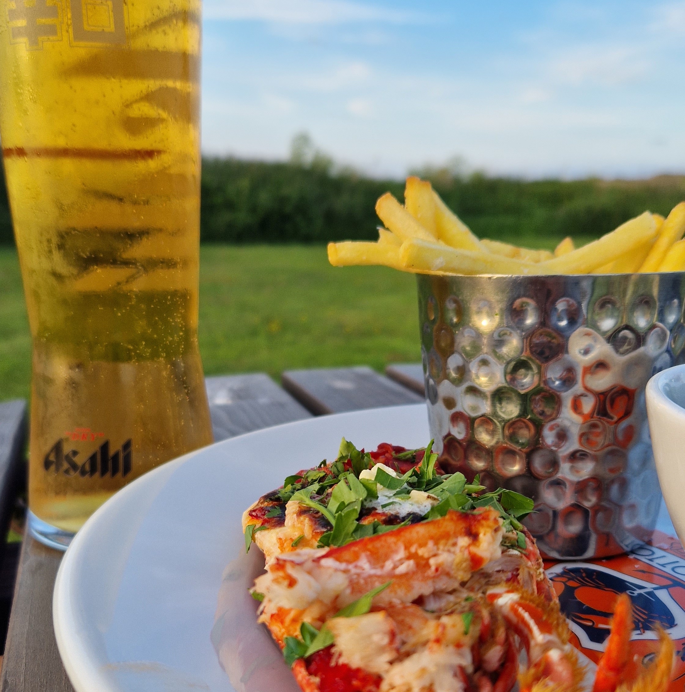 photo of a lobster meal and beer at Rocky Bottoms